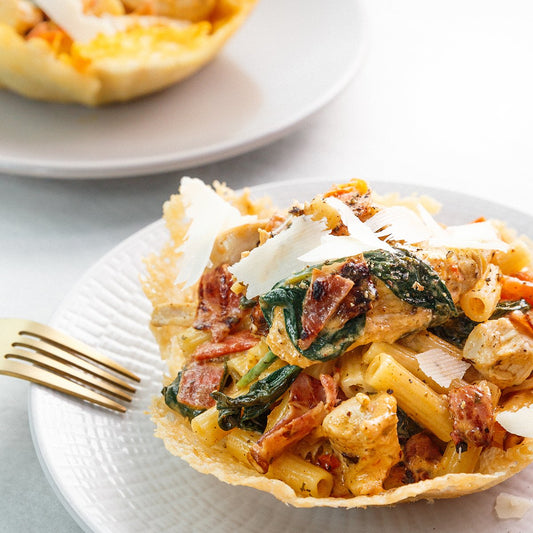 Creamy Lemon Chicken With Pene on a Parmesan Bowl