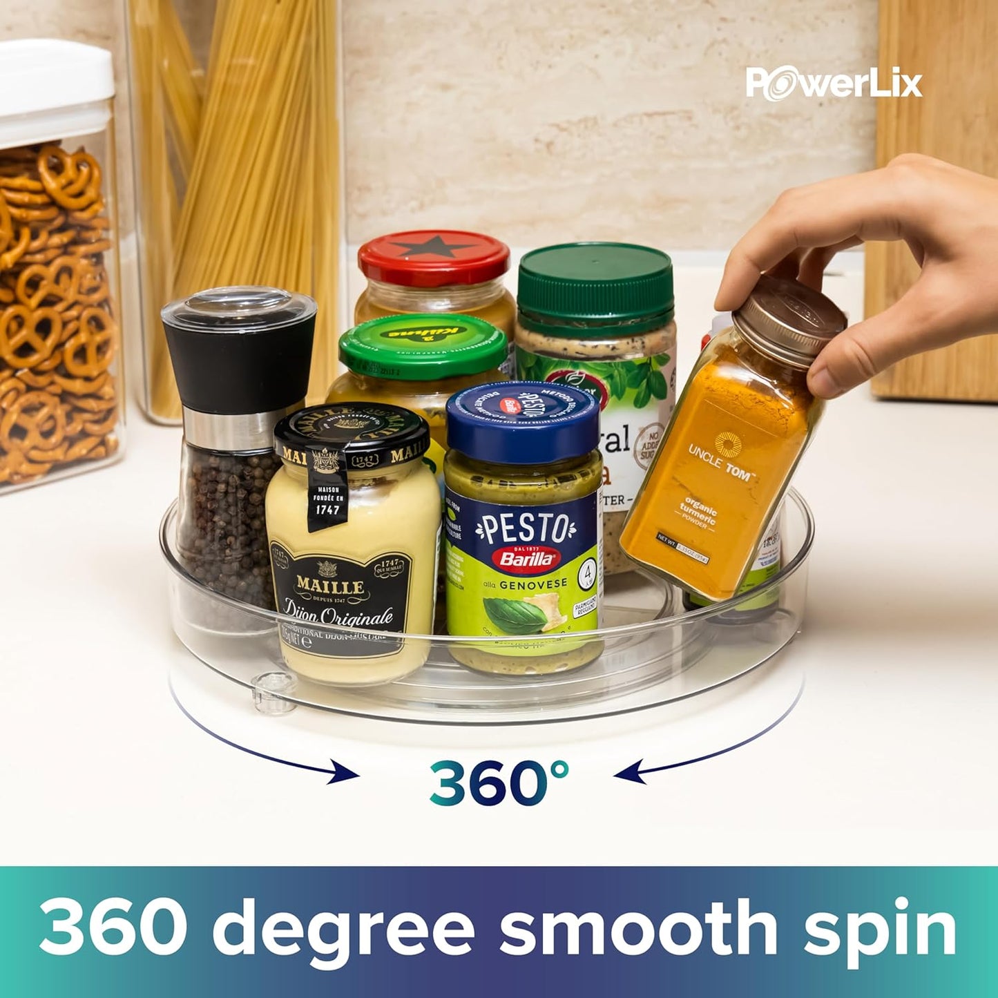 a hand holding a jar of seasoning with text: 'PowerLix al NO UNCLE MAIL TER turmeric POWDER- PESTO NET Barilla® 4 MAILLE alla GENOVESE Con 360º 360 degree smooth spin'