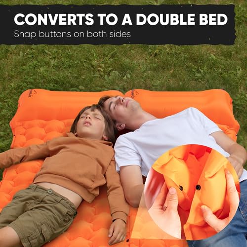 a person and child lying on an orange mattress with text: 'CONVERTS TO A DOUBLE BED Snap buttons on both sides'