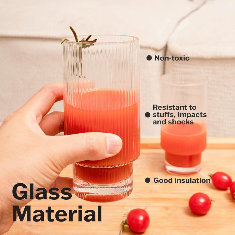 a hand holding a glass of juice with text: 'Non-toxic Resistant to stuffs, impacts and shocks Glass Good insulation Material'