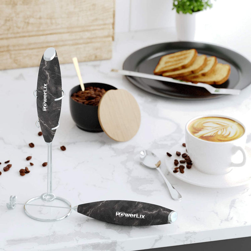 a coffee cup and spoons on a table with text: 'PowerLix PowerLix'