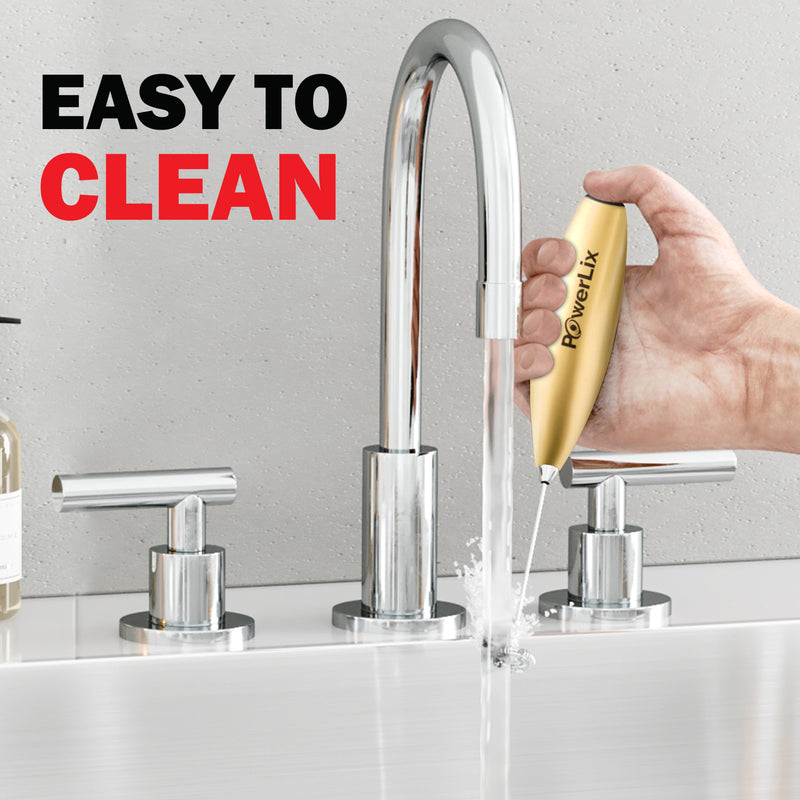 Powerlix milk frother in vegas gold at a sink, under running water. Text above reads "Easy to clean!"