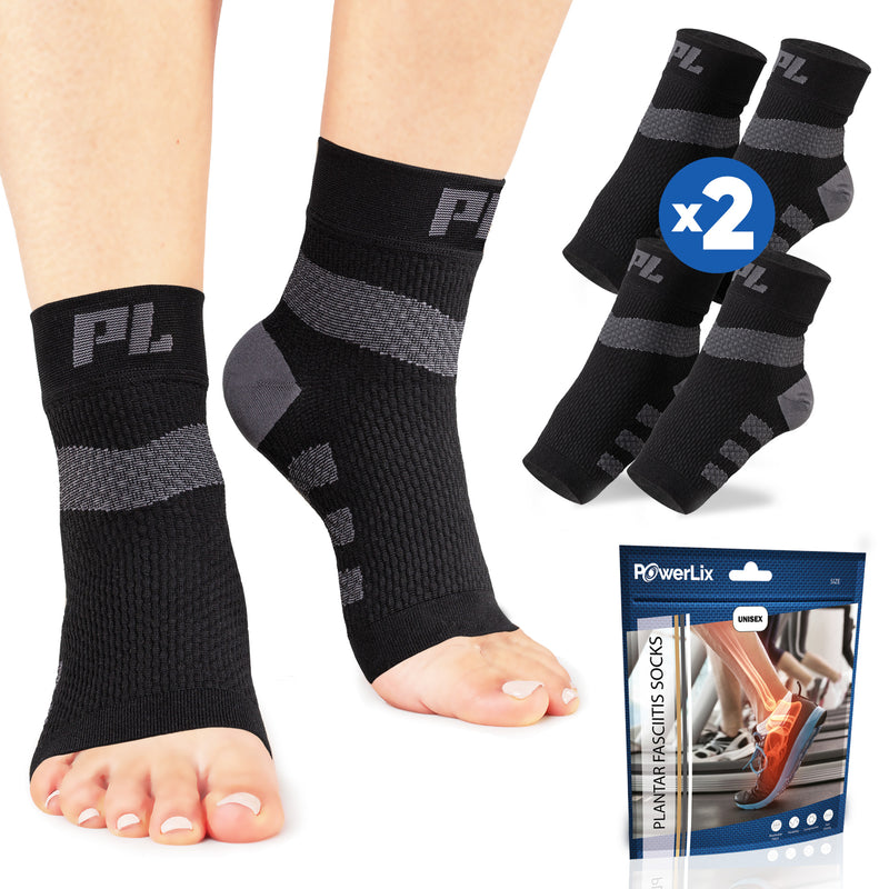 Powerlix plantar fasciitis support socks in black on a model with the bag they come in behind the model. Two pairs are displayed in the background.