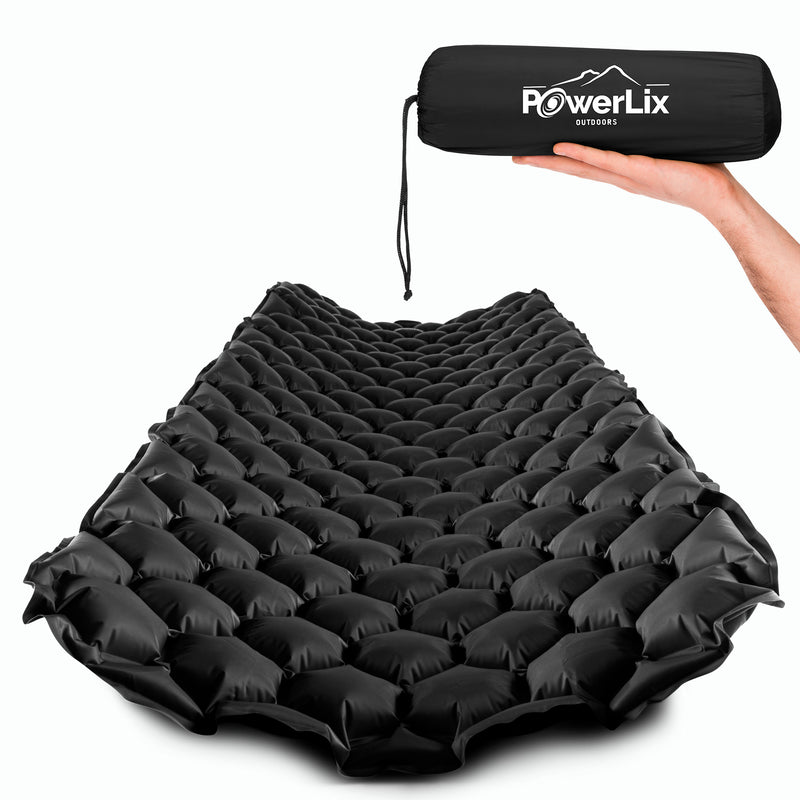 Black inflated sleeping pad, also show stored in the Powerlix Outdoors bag, held by a hand.